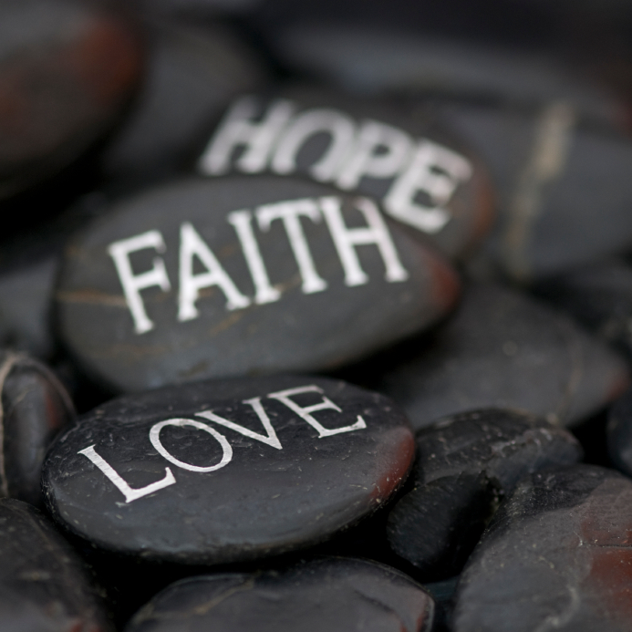 stones with message: love, faith, hope